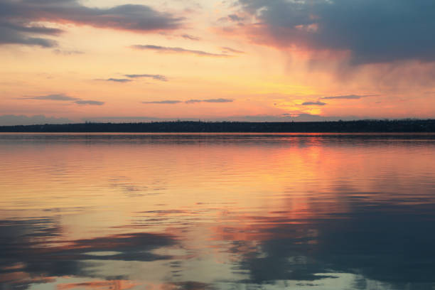 istock Amazing sunset with clouds and river. Nature background 1210745099