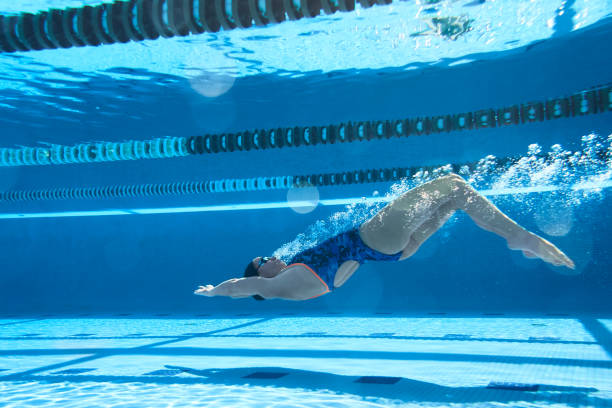 istock Adaptive Athlete diving underwater in a swimming pool. 1210745576