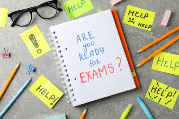 istock Inscriptions Are you ready for exams? and Help on grey background, top view 1210745674