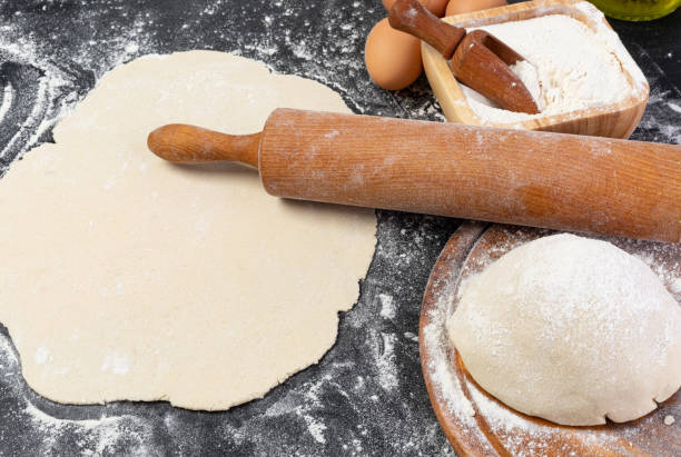 istock Preparation of the dough. The rolling pin with flour 1210746164