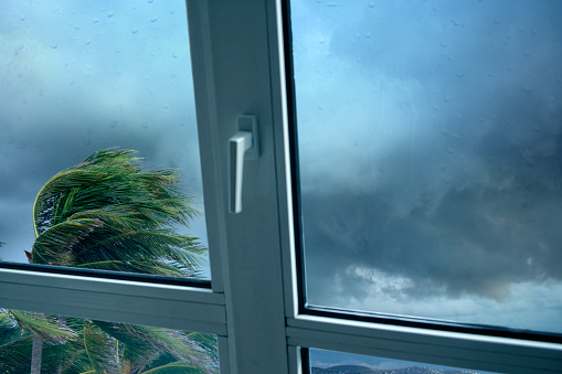 close up window and powerful tropical storm