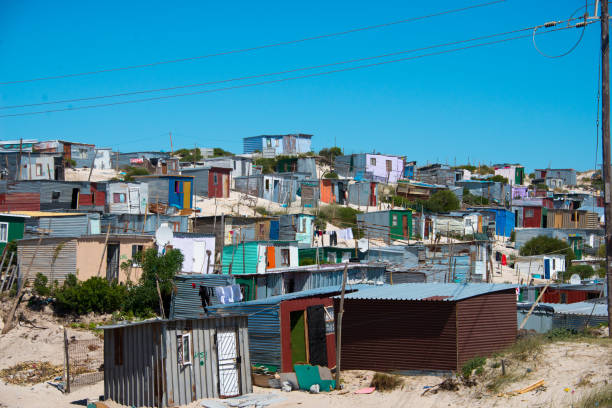 shacks in informal settlement in khayelitsha township shacks in informal settlement in khayelitsha township, cape town, south africa hut photos stock pictures, royalty-free photos & images