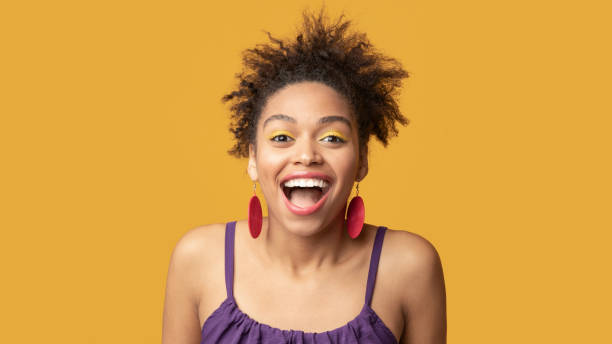 istock Happy black woman screaming looking at camera 1210748571