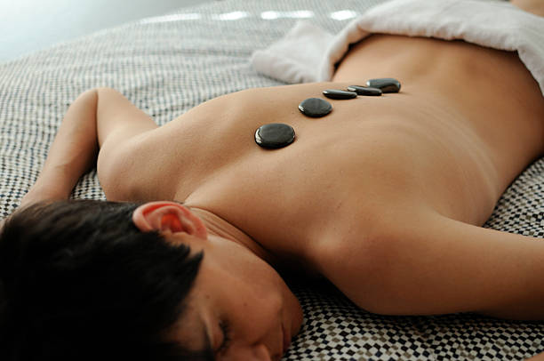 istock Woman getting hot stone massage 121074938