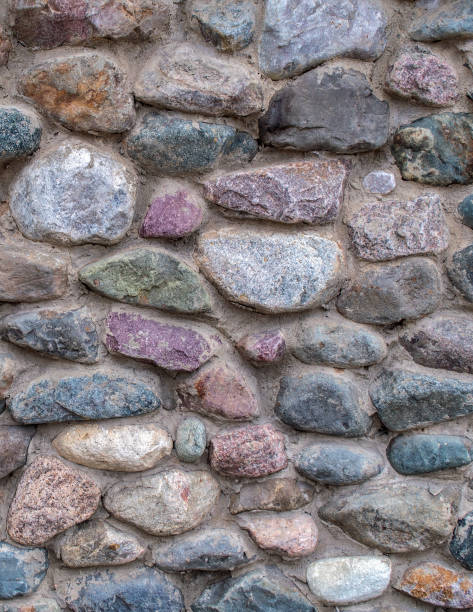 istock stone wall of large cobblestones. stone texture background. 1210752415
