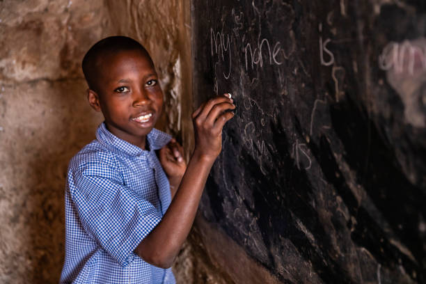 istock African young boy is learning English language, orphanage in Kenya 1210753630