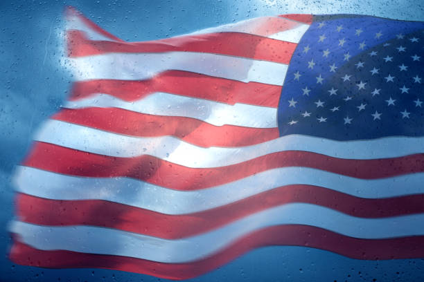 istock American flag in rainy day 1210753807