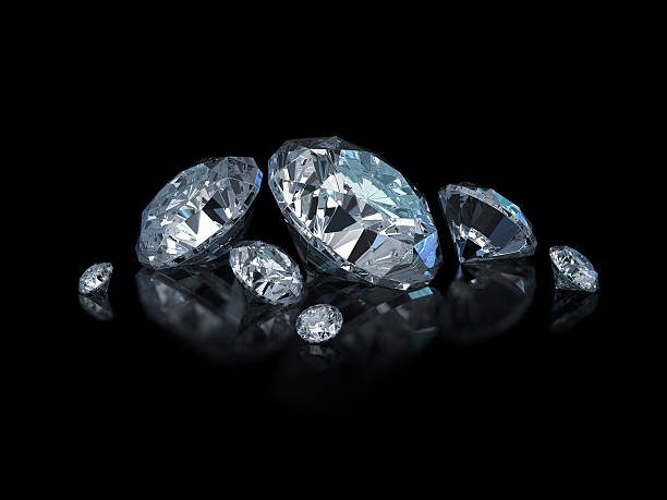 istock Different sized, cut and polished diamonds isolated on black 121075491
