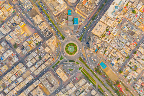 istock Aerial top view of roundabout, highway junctions. Roads or streets shape circle in structure of architecture and technology transportation concept. Urban city, Dubai downtown at sunset, UAE country. 1210754965