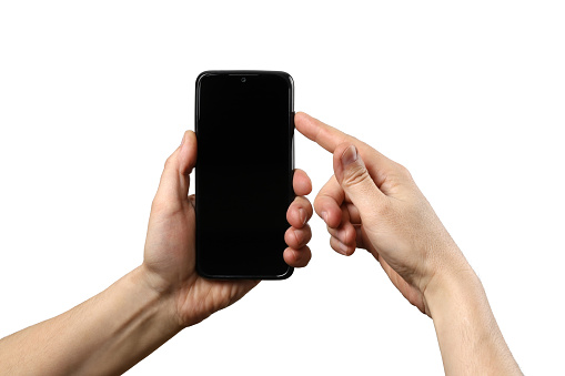 One man hand holds a smartphone, the other turns it on. Isolated on a white background