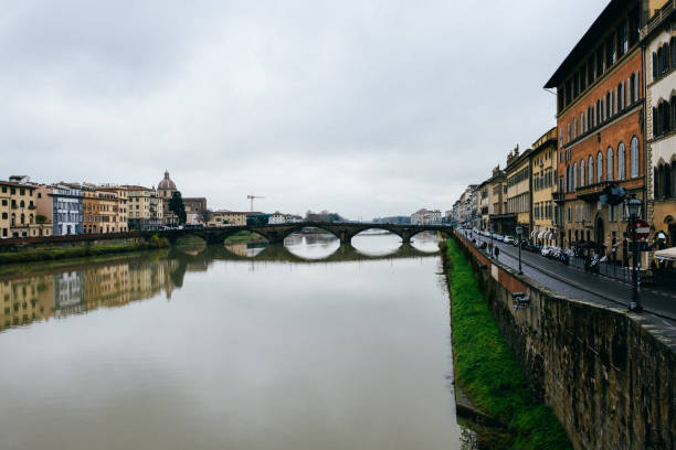 6th June, 2022 -View of the famous Ponte Santa Trìnita bridge over the river Arno in the Italian Renaissance town of Florence on a sunny day.