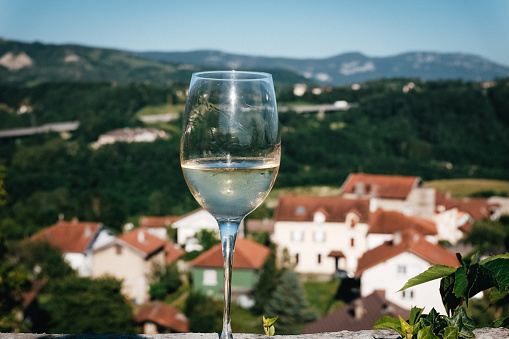 Glass of white wine in a French landscape