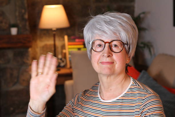 istock Senior at home woman saluting 1210757848