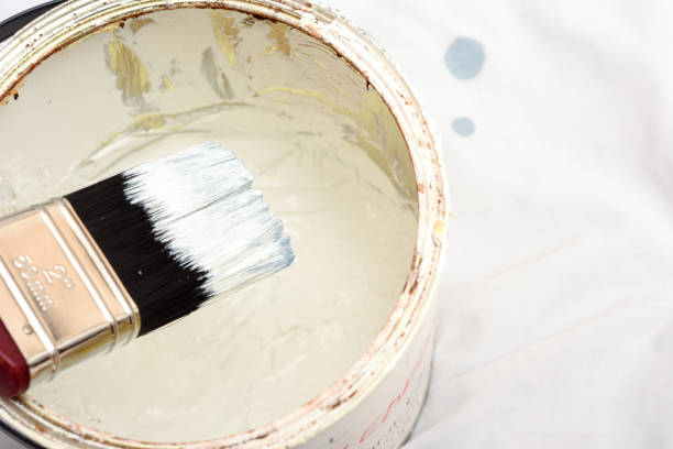 istock Open tin of white paint for decorating and home improvements 1210759559