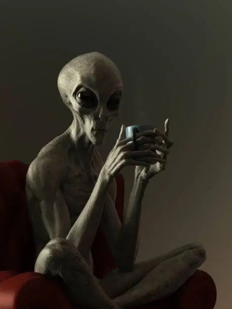 An alien sits on a red leather chair, drinking a hot beverage from a mug. He is making eye contact with the camera. The overall scene is starkly lit in low, subdued light.