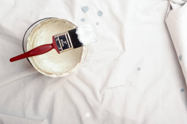 Open tin of white paint for decorating and home improvements