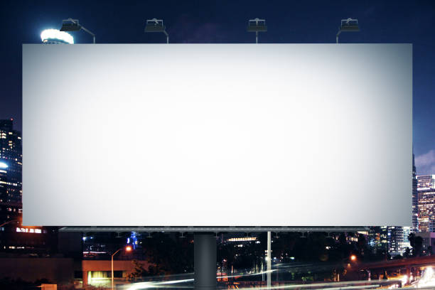 istock Blank white banner on night city background. 1210761030