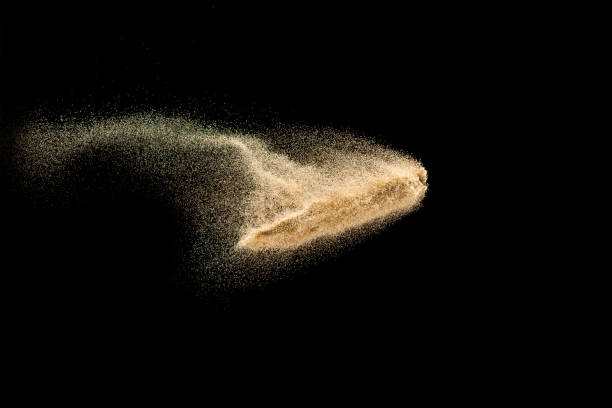 istock Dry river sand explosion.Brown color sand splash against black background. 1210762614