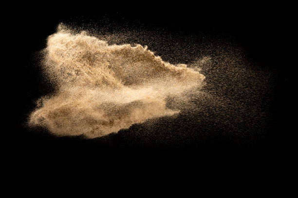 istock Dry river sand explosion.Brown color sand splash against black background. 1210762629