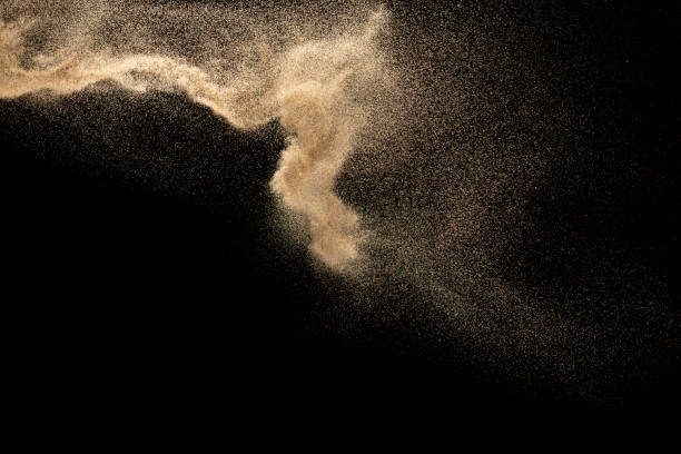 istock Dry river sand explosion.Brown color sand splash against black background. 1210762641