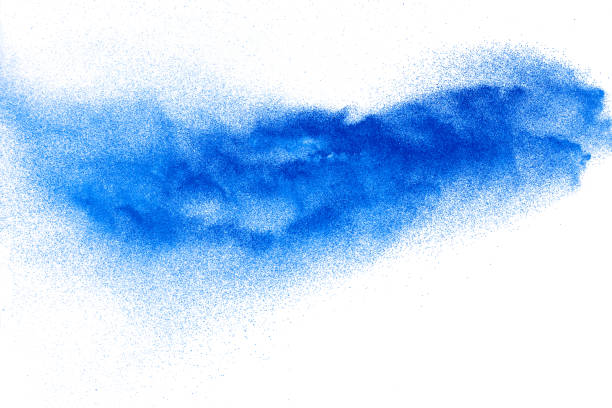 istock Bizarre forms of blue powder explosion cloud on white background. Launched blue dust particles splashing. 1210762740