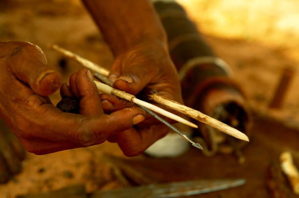 istock Himbas in jewelry and arrow making 1210763222