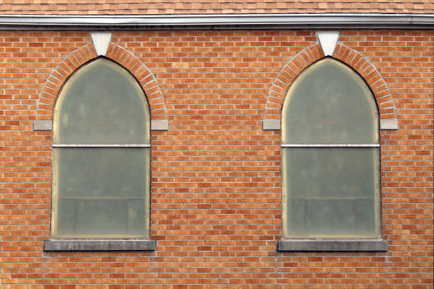 istock retro arched vintage church windows red brick wall 1210765612