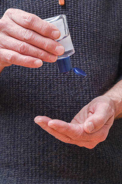 istock Person using antibacterial hand gel to kill gerns 1210771234