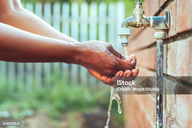 We All Need To Start Being Water Wise Stock Photo - Download Image Now - Faucet, Outdoors, Hand