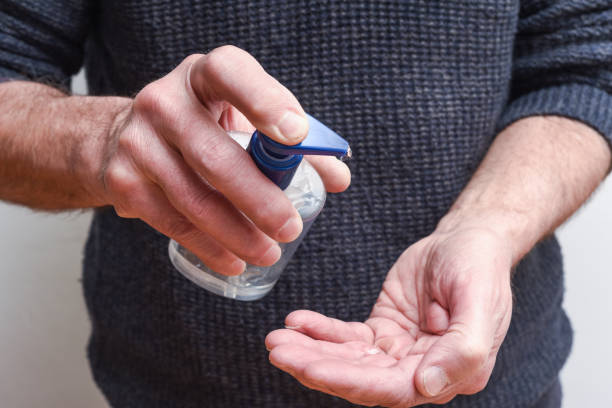 istock Person using antibacterial hand gel to kill gerns 1210772592