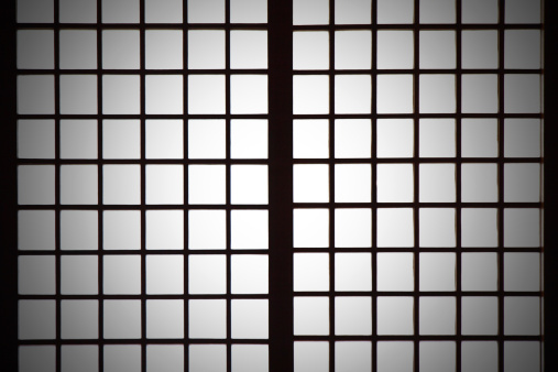 Backlit Japanese style paper screen partition (Shoji) with vignetting.