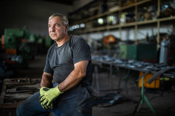 istock Industrial worker at metal factory 1210774487