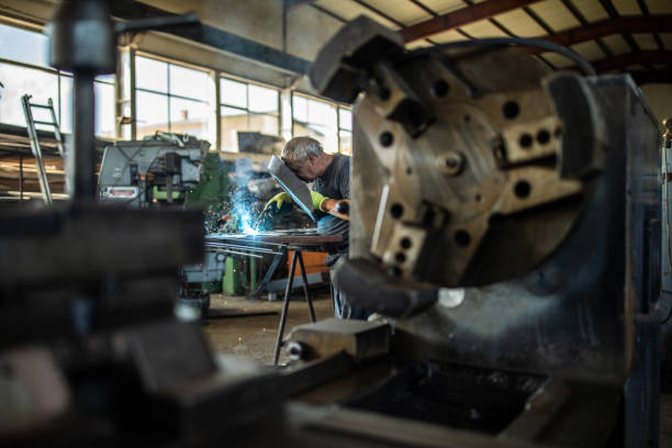 istock Welder working at metal factory 1210774515