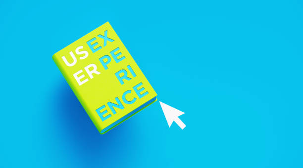 Book of User Experience Over Blue Background Book of user experience sitting over blue background. User experience written on the book  and sitting next to a computer cursor. User experience concept. cursor photos stock pictures, royalty-free photos & images
