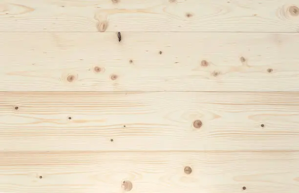 Close-up of a polished spruce board. Full frame background, photographed from above. You can use it for graphic design, pin board or furniture surface.