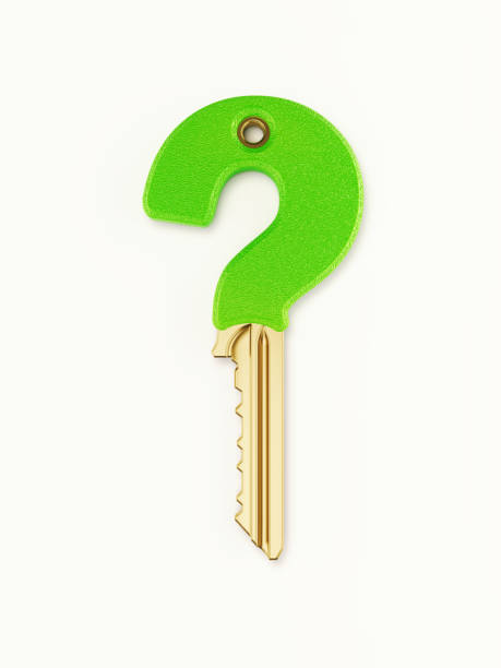 istock Question Mark Shaped Bronze Key Covered with Green Plastic on White Background 1210775753