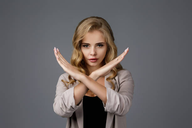 istock beautiful business woman making stop gesture 1210778066