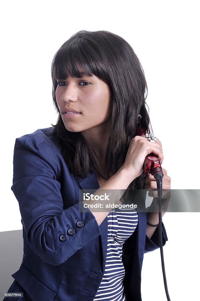 Junge Frau mit Glätteisen. - Lizenzfrei Asiatischer und Indischer Abstammung Stock-Foto