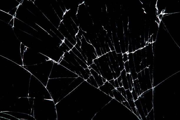 istock cracked glass isolated on a black background. 1210780005