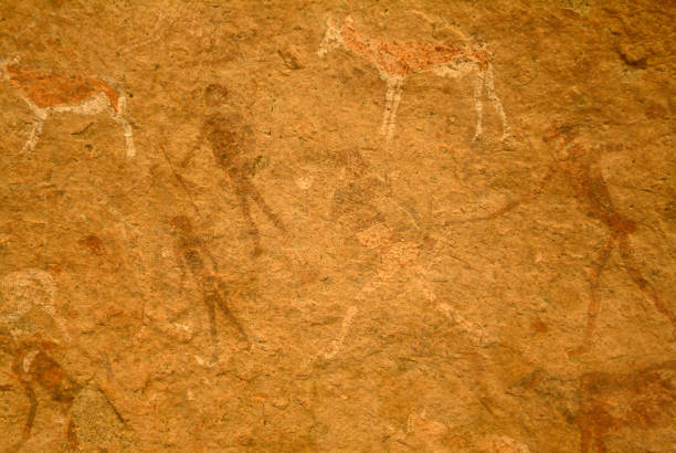 Cave painting from Namibia Faded cave painting from Namibia with animals and people as motifs stone age stock pictures, royalty-free photos & images
