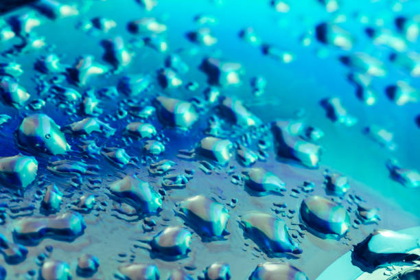 istock Close up beautiful abstraction phantom blue color light water drop of holographic effect. Background pattern for design. Macro photography view. 1210781293