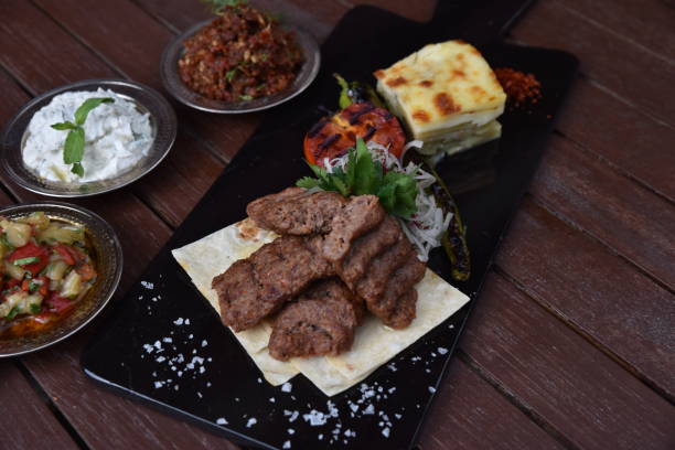istock grilled Adana kebabs and vegetables 1210782735