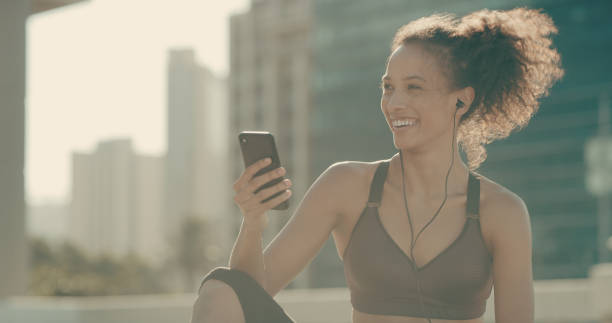 istock Switching through to her favourite playlist 1210783780