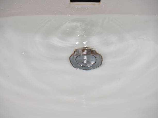 istock tap faucet in basin 1210783973