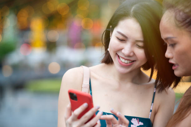 istock Networking. Young Asian business women networking during a break 1210784862
