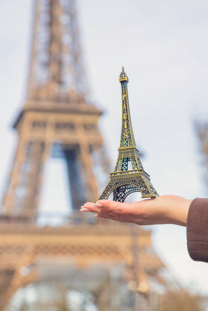istock Girl with the Eiffel Tower in her hands. Selective focus. 1210785787