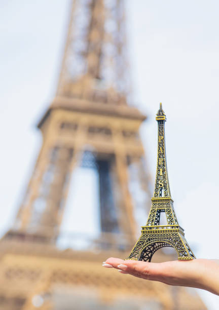 istock Girl with the Eiffel Tower in her hands. Selective focus. 1210785799