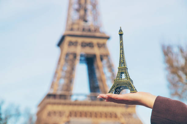 istock Girl with the Eiffel Tower in her hands. Selective focus. 1210786659