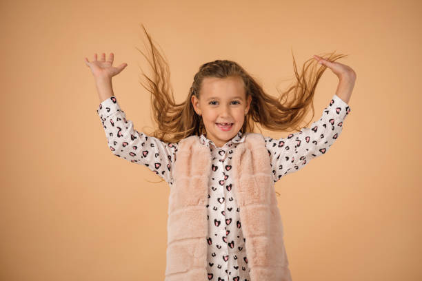 istock child with flying hair 1210788379
