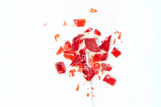 istock broken heart red lollipop sweet isolated on white background 1210789769